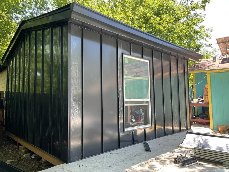 Black standing seam metal wall panels for Roof Inspection in Stansbury Park