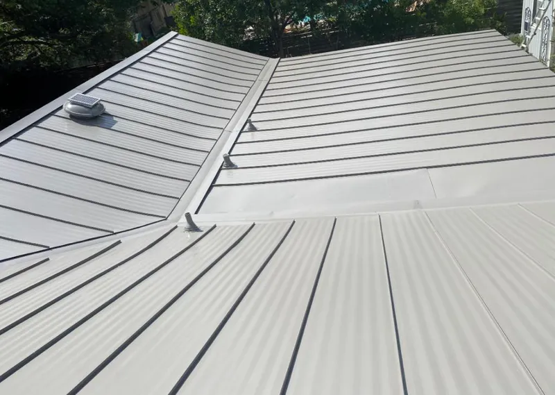 Solar attic fan installed on a metal roof for Roof Ventilation in Stansbury Park